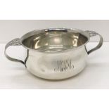 A hallmarked silver "porringer" two handled cup, weight 110.4g