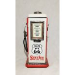 A small storage cupboard in the form of an American Route 66 gas pump H 40cm