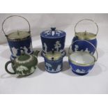 A collection of four Wedgwood Jasper Ware pieces including a biscuit barrel and teapot plus two