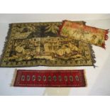 Two decorative wall hangings along with a small red ground runner