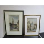 A framed watercolour of a continental street scene signed by artist Charles P. Pitt, along with an