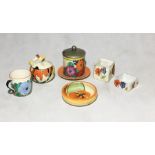 A small collection of Clarice Cliff pottery along with three others including a small "Nasturtium"