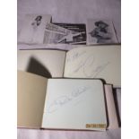 Two autograph albums containing various signatures including Frankie Howard, Dick Emery, Norman