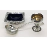 A hallmarked silver mustard with blue glass liner along with a silver egg cup and Georgian ladle