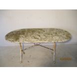 A marble topped garden table on a wrought iron base. 140cm x 70cm