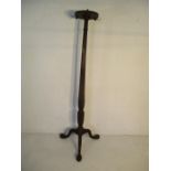 A hat and cloak stand on tripod base with claw & ball feet