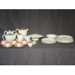 A part Poole Pottery tea/coffee set along with a Grindley "Fantasia" Part dinner set