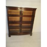 An Edwardian Simpoles Chapter sectional bookcase with glass doors in four sections