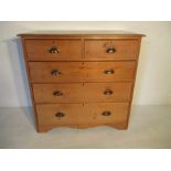 A pine chest of five drawers