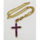 A tested gold ( 18ct) cross set with amethysts and diamond on a tested gold ( at least 14ct) gold