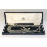 A vintage "crystal" double string necklace and earring set with silver clasp in fitted case along