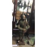 A cast iron companion set in the form of a knight with poker and tongs - overall height 92cm