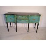 A painted serpentine fronted sideboard