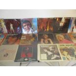 A collection of 19 vinyl records including Elvis Presley special pink pressing double album, ABBA,