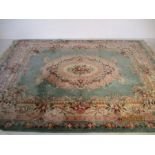 A large oriental carpet. 368cm x 275cm