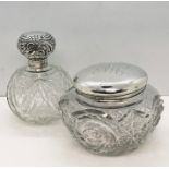 A cut glass powder bowl with hallmarked silver lid along with a silver topped scent bottle ( hinge