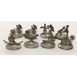 A set of oriental silver menu holders all showing different scenes including a rickshaw, Kris