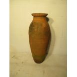 A tall terracotta urn - overall height 102cm