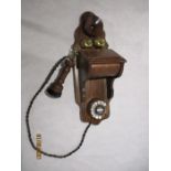 A reproduction wall mounted telephone