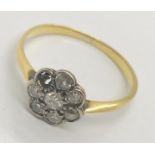 An unmarked gold diamond cluster ring- 1 stone missing