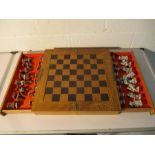 A wooden chess set with Oriental style pieces