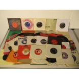 A collection of 7" vinyl singles including The Bee Gees, Shirley Bassey, Art Garfunkel, Creedence