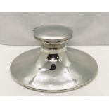 A hallmarked silver captains inkwell ( diameter of base 17.75 cm)