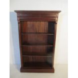 A Victorian style freestanding bookcase with one drawer