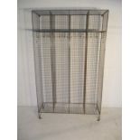 A vintage wirework locker room storage unit