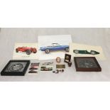 A collection of various motoring memorabilia including clocks, prints, postcards etc.