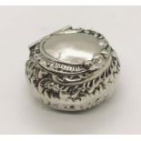 A hallmarked silver pill box