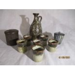 A set of six studio pottery beakers (1 A/F) by Peter Smith, along with a similar jug. bakelite