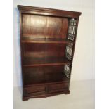 A hardwood bookcase with two drawers under