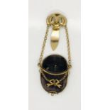 A Chatelaine containing a monocle in velvet case