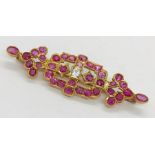 A ruby and diamond brooch set in 18ct gold ( tested)- total weight 6.5g