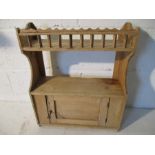 A small pine hanging cupboard