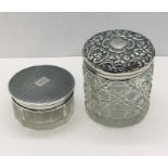 Two dressing table pots with hallmarked silver lids