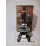 A Cooke, Troughton & Simms microscope in mahogany carry case