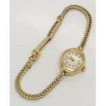 A ladies 9ct gold Rotary watch with 9 ct gold strap, total weight 11.6g