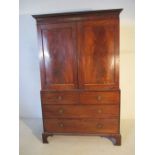 A George III mahogany linen press - height 217cm, width 137cm, depth 63cm