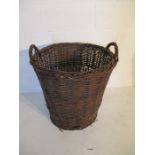 A large wicker log basket