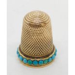 An unmarked gold thimble set with turquoise, total weight 4.8g