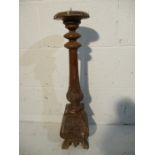 A Continental wooden Ecclesiastical candlestick, height 61cm