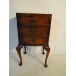 A bow fronted bedside cabinet with one drawer and cupboard under