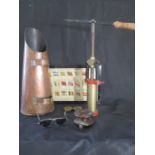 An assortment of vintage items including copper scuttle, sunglasses, fishing reel, spaghetti maker