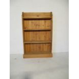 A freestanding bookcase- height 121cm, width 76cm