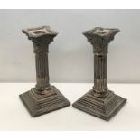 A pair of hallmarked silver Corinthian column candlesticks height 61cm