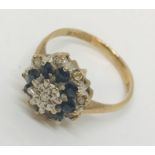 A 9ct gold diamond and sapphire cluster ring