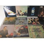 A collection of 12" vinyl records including Free, Steely Dan, Madness, Deep Purple, Thin Lizzy,