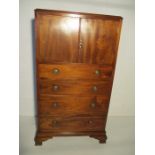 An Edwardian inlaid tallboy with cupboard over four drawers